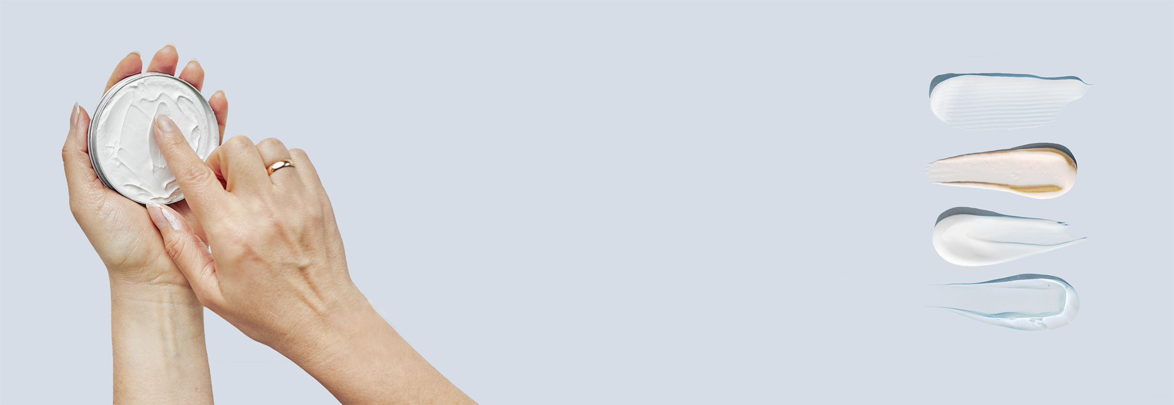 Two hands holding a container of skincare cream and a closeup of a variety of skin care products spread on a flat surface